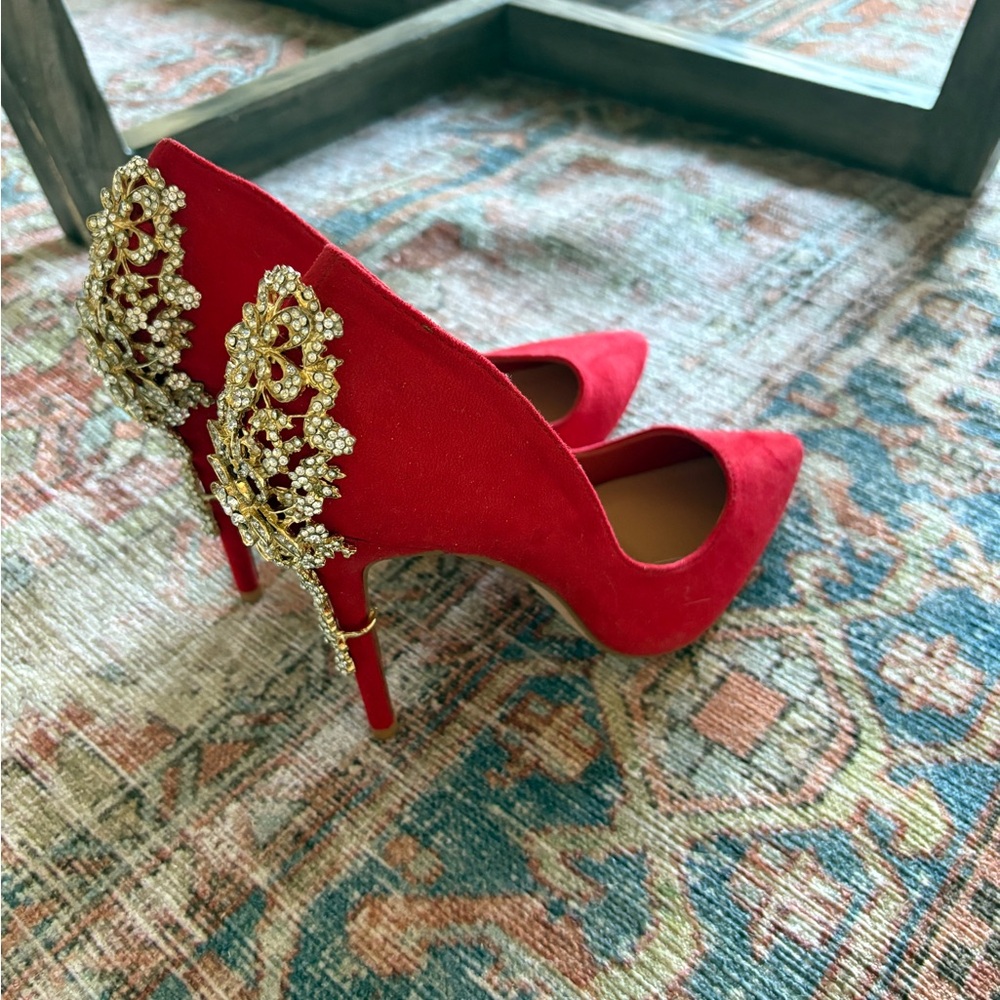 Elegant Red Heels with Gold Embellishments